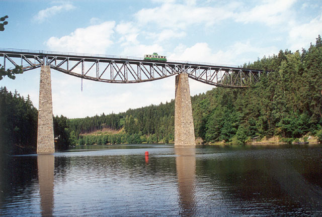 Bridge over the valley of the river Mže (today Hracholusky dam). Historical motortrain called "Tower" on the bridge.